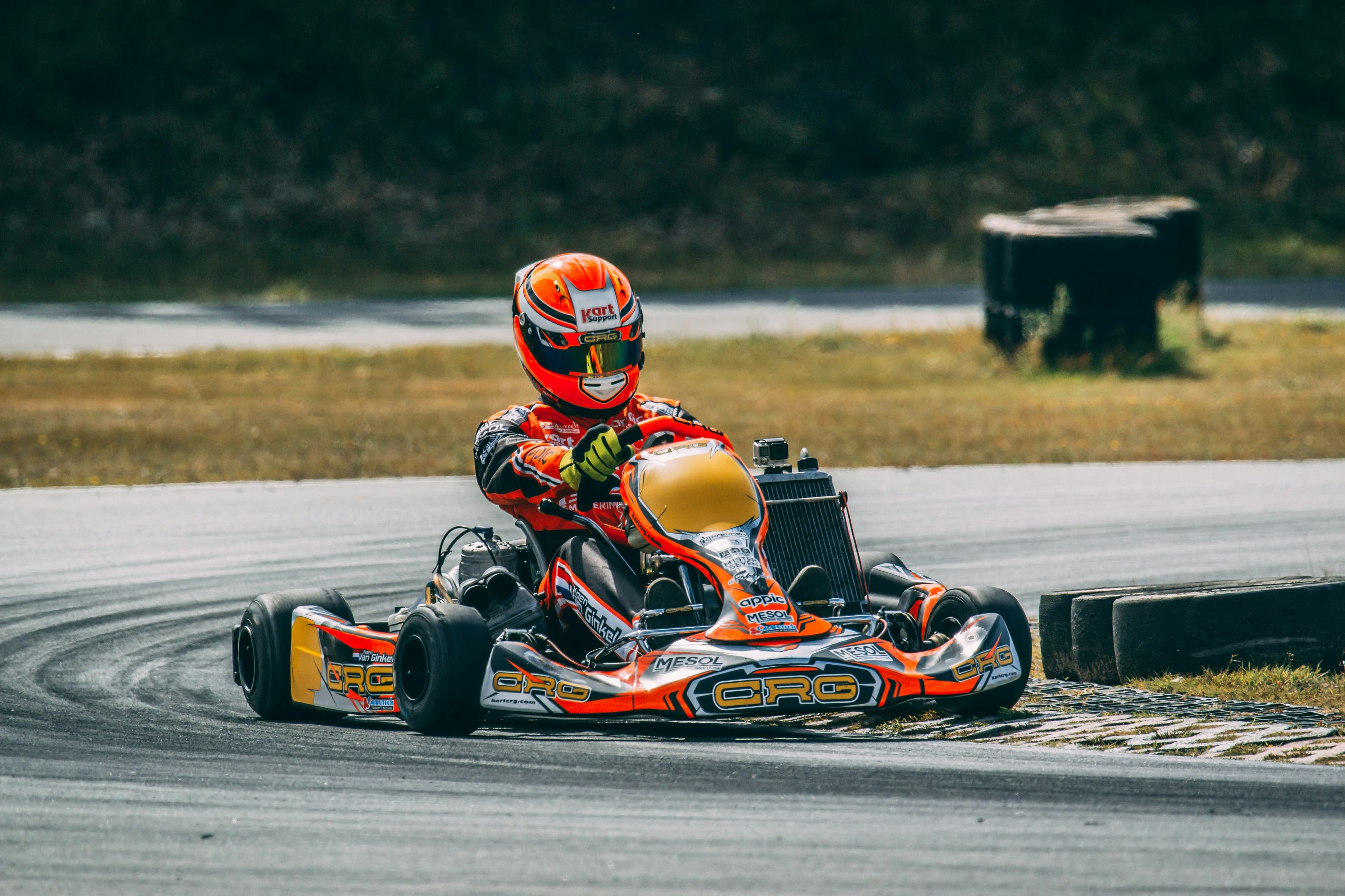 Go-kart cornering on a tarmac circuit